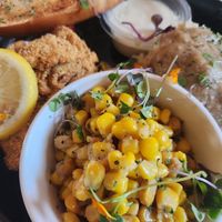 Fried "fish" oysters, corn, mashed potatoes, and garlic bread at Vegan Food House in Dallas