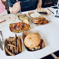 Shrimp Creole Nachos middle left; Chick’em Sammich bottom right; Buffalo wings middle right at Vegan Food House in Dallas