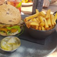 Artichoke burger with vegan cheese and fries at The Olive Tree in Mallorca