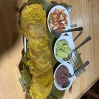 Patacones con pico de gallo, guacamole y frijoles  at La Amistad in Monteverde