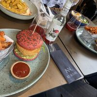 Vegan quinoa burgers, planted chicken/hummus bowl, ramen soup/bowl and local ice tea at No Name in Chur