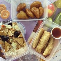 Tofu chopsui with rice, veggie spring rolls and fried bananas. at Kitajski Dvor in Celje