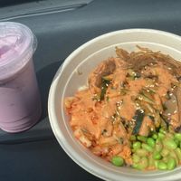 Raspberry shake and vegan bibimbap with white rice, japchae, kimchi, edamame, cucumber salad, and shiitake mushrooms in mild sauce. at K Fresh in Everett