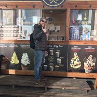 Happy chimney cake eater  at Kurtoskalacs The Chimney Cake Shop in Budapest
