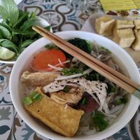 Center and left: the phở and its complimentary herbs. Right: extra fried tofu at Loving Vegan in Da Nang