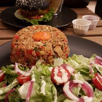 Riz sauté et dark knight burger at EnVie Vegan in Geneva