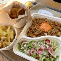 Fried rice with salad, ‘chicken’ nuggets and chips at EnVie Vegan in Geneva