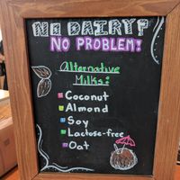 Advertising for (mostly) non-dairy milks! Oat milk is new as of May 2019 :) at Good Earth Coffeehouse - Taylor Family Digital Library in Calgary