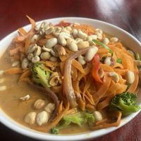 Sweet potato noodles with veggies in coconut milk sprinkled with toasted peanuts  at Cafe Escondido in Roatan