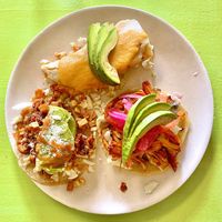 Taste of Yucatán sampler: Longaniza con Papa taco, Jackfruit Cochinita tamale, and Panucho taco.
  at Hijo De Su Madre in Los Angeles