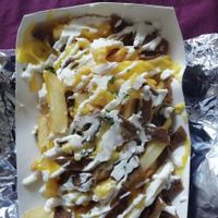 Loaded fries: garlic sauce, vegan cheese, parsley and seitan at Soul Shack Vegan Grill in Newcastle Upon Tyne