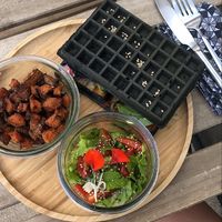 Charcoal waffle with seasonal grilled veggies and avocado & roasted sweet potatoes  at SLOW in Soorts-hossegor