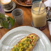 Tofu scrambled with avocado; passions fruit smoothie; coconut pancake; ginger coconut latte   at Bong Bonlai at YK Art House in Phnom Penh