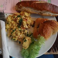 Vegan scrambled eggs, crossaint, hummus at Kult in Wurzburg