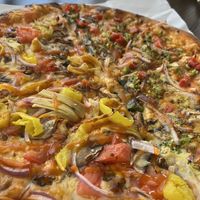 This is a fully vegan pizza, 12 inch, buffalo sauce, two types of vegan cheese (Numu and Tofu Ricotta) with all vegetable toppings.  at Create A Pizza in Rochester