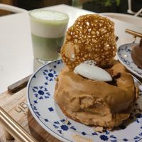 Matcha latte and caramel doughnut at Scoop 'n Dough in Lisbon