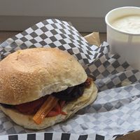 Vegan sandwich and yogurt with fresh fruit underneath at Rosemary in Rome