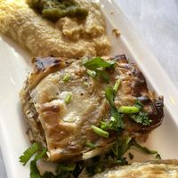 Spicy Vegan Rarghifat.  Phyllo wrapped veggies with spicy harissa served with Jalapeños hummus.   at Oasis Restaurant and Catering in Pismo Beach