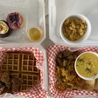 Chicken and waffles, the vegan scrambler, a side of eggs, a blueberry cupcake and a chocolate turtle cupcake at Southern Vegan Soul Cafe in Macon