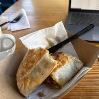 Oat milk latte & vegan breakfast burrito   at Full Stop Station in Louisville