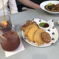 Mixed fritters plate and Dahl. Drinks: Indian coffee tonic with grapefruit, and turmeric raspberry coconut drink  at Flyover Fritterie & Chai Bar in Redfern