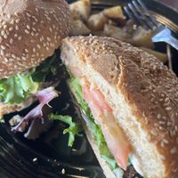 Burger with a side of potatoes   at The Grain Cafe in Redondo Beach