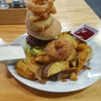 The Barley Burger, served with chunky chips, onion rings, tomato sauce, and house blend aoili.  at Barley in Palmerston North
