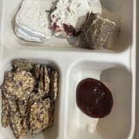 Flight of cheese with seeded crackers  at Rebel Cheese in New York City