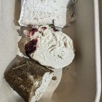 (Top to bottom) Truffle Brie, cranberry dill no-goat, triple peppercorn chèvre   at Rebel Cheese in New York City