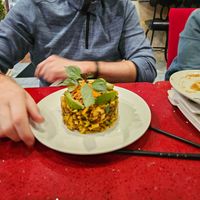 Risotto
wild rice, zucchini and coconut in marinara sauce. Topped by avocado, marinated mushroom, carrot and rice paddy herb. at Au Lac in Fountain Valley