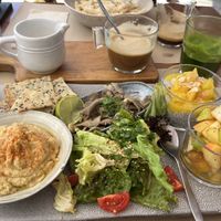 Vegan breakfast, hummus, juice, coffee, fruit, mushrooms & chia seed pudding  at Tazza in Giro in Lisbon