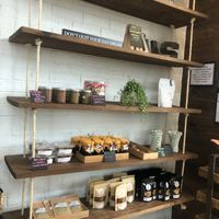 estante con algunas mantequillas veganas  at JuiceUs in Brownsville