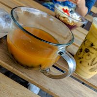 Pozole; also pictured is golden milk and acai bowl at JuiceUs in Brownsville