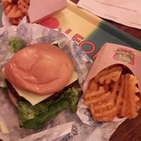 Vegan "Love Burger" with baked waffle fries. at LEON - Temple Bar in Dublin