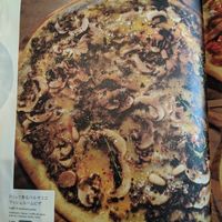 Menu page showing mushroom pizza at Latte Graphic in Tokyo