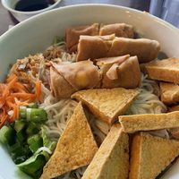 Noodle bowl with egg rolls and fried tofu   at Pho 16 in West Palm Beach