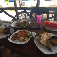 Vegan Rotti Chanai, potatoes wedges without Mayo, fruit salad and curry with rice at Chillout Cafe & Craft in Perhentian Islands