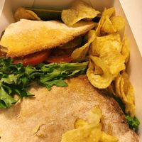 I think this was a BLT. All their sandwiches come in pizza crusts, so unique! I prefer the vegan Philly cheesesteak, but ate it too fast for a picture!  at Brick Road Pizza Co in Grand Rapids