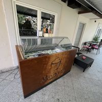 ice cream chest freezer in front of the entrance  at Kavarna Sladoledarna Magnus in Nazarje