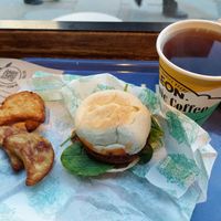 Hash browns (interesting twist with the parsnip), 'Vegan Sausage Muffin'  with spinach, and coffee at LEON - Strand in London