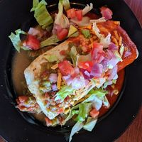 Smothered "hefty one" burrito filled with facon, quinoa, squash and chille at Wanderlust Vegan Eatery in Albuquerque
