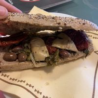 Sandwich with olives, sundried tomatoes, artichokes and spinach.  at NAP - Tradizione Italiana Cocktail Bar - T1 in Naples