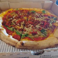 Vegan pizza with spinach, sun dried tomato, and vegan sausage. at 800 Degrees in Fort Wayne