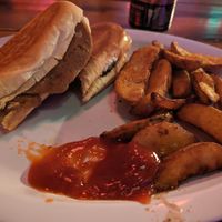 Partially eaten (sorry) vegan Cubano with wedge fries at The Church Cantina in Tacoma