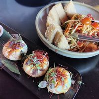 Top rights: crispy tofu with papaya salad, bottom left: Pan-fried shiitake mushroom BBQ buns at Yulli's in Byron Bay