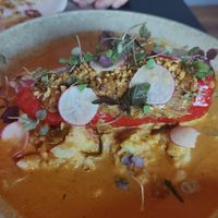 Banana peppers stuffed w shitaki mushrooms, bamboo, tofu and cashew cream, served on coriander mash and finished w kaffir lime and Penang curry at Yulli's in Byron Bay