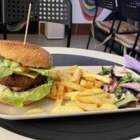Smokey burger (29 lei) with salad and fries (9 lei)  at Level Up in Bucharest
