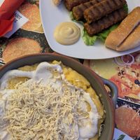 Mici (sausages) and Mâmâligâ (polenta, sour cream and cheese) - sounds interesting but I really liked it! at Level Up in Bucharest
