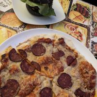 Salami pizza and a burger. at Level Up in Bucharest