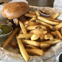 BBQ tofu sandwich with pickles, fried onions and fries  at Brothers BBQ in Broomfield